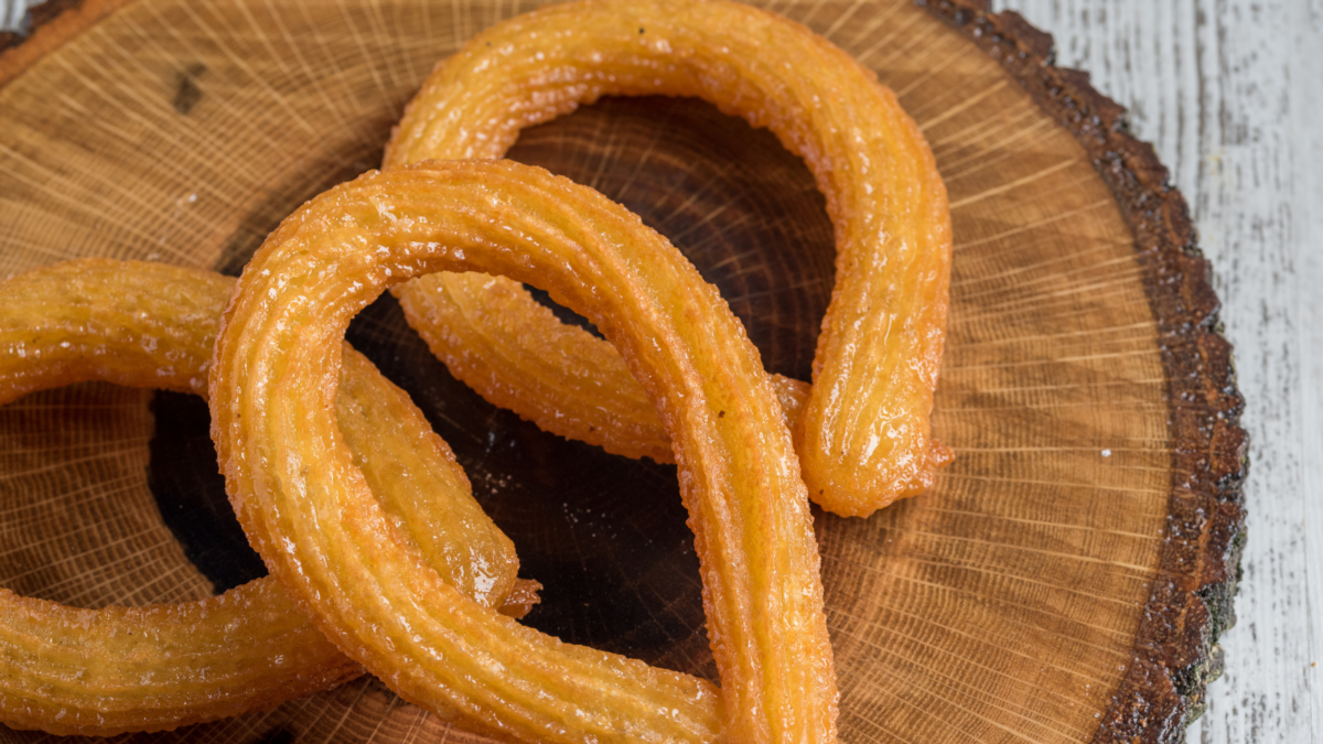 Twisted Churro dessert on wooden table.