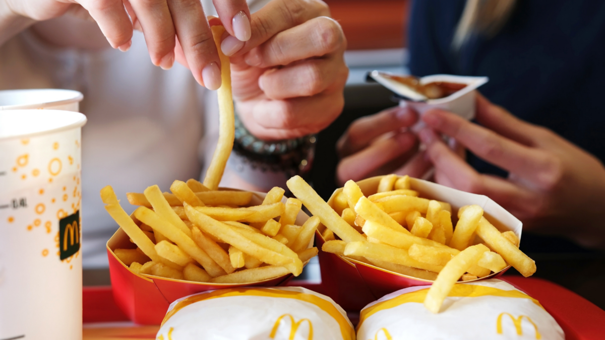 Family Dining At Mcdonald's Fast Food Restaurant