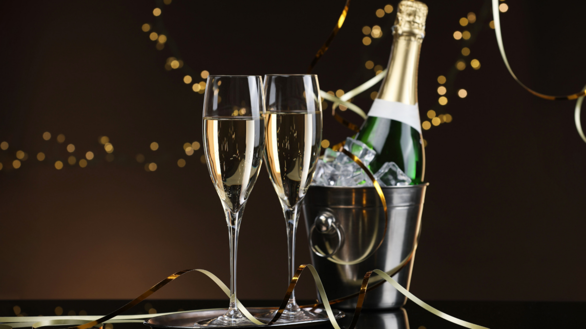 Champagne in glasses and ice bucket with bottle