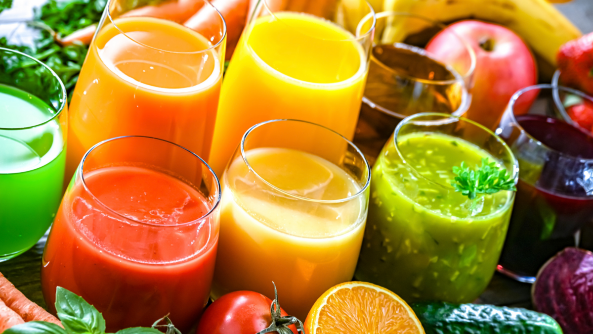 Glasses with fresh organic vegetable and fruit juices