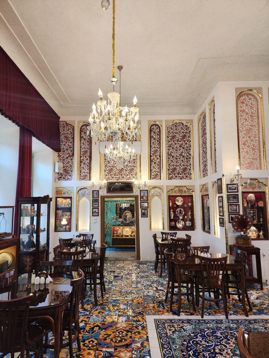 Charming Iranian tea house with intricate decor and chandeliers in Tabriz, Iran.