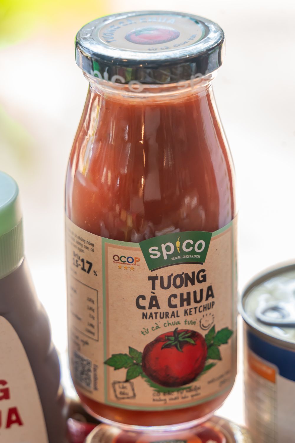 Close-up of a natural tomato ketchup bottle with visible label and branding.