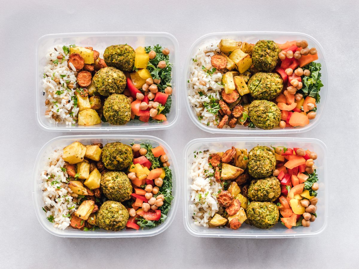 Does the Blood Type Diet Actually Work? Scientists Examine The Claims Behind The Popular Eating Plan 1 Colorful meal prep containers with falafel, chickpeas, rice, and vegetables for a healthy lifestyle.