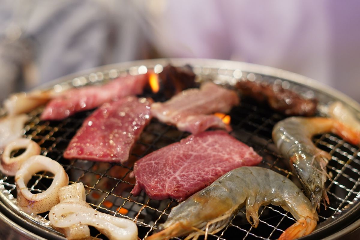 NYC’s “Make Food Not Waste” Restaurant Week Returns, Turning Kitchen Scraps Into the Main Event 2 Delicious combination of grilling seafood and meat close-up on a BBQ grill.