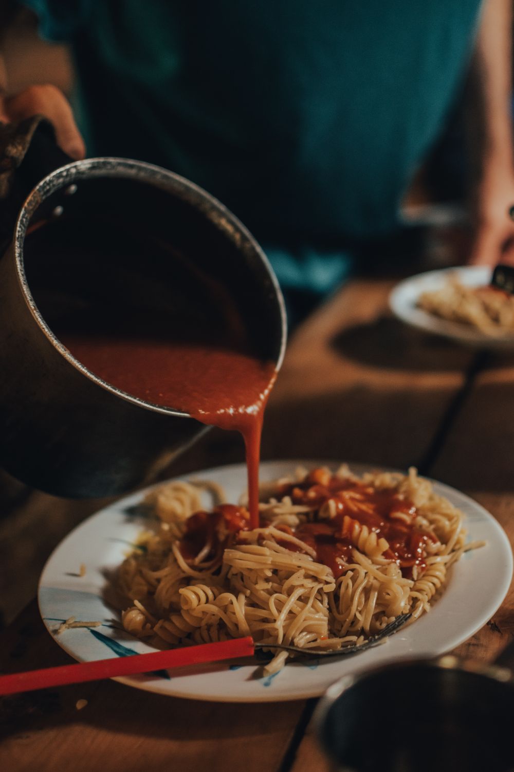 5 Homemade Dinners That Feel More Romantic Than Takeout 1 Delicious homemade pasta served with rich tomato sauce, perfect for a cozy family meal.
