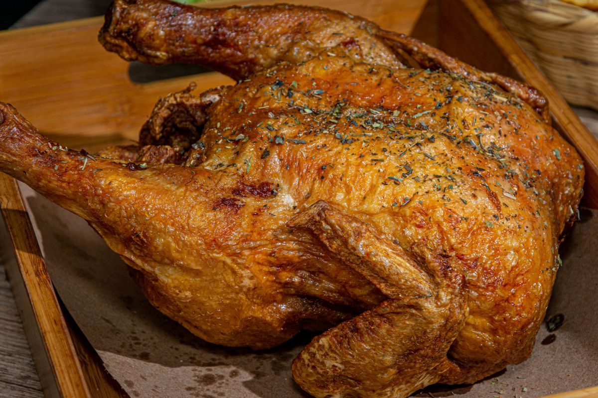 Deliciously roasted chicken seasoned with herbs, perfect for a hearty meal.