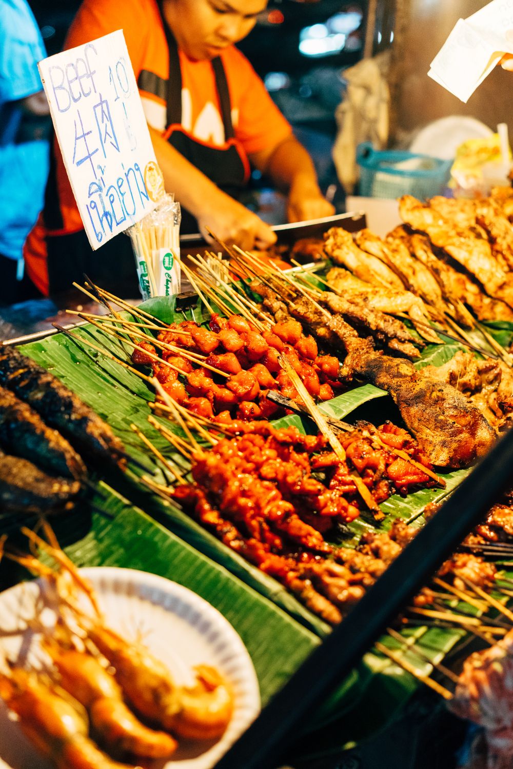 What Happens When Texas Barbecue Meets Thai Food? This New Restaurant Is Finding Out 1 Discover vibrant Thai street food skewers at a busy Chiang Mai market stall.
