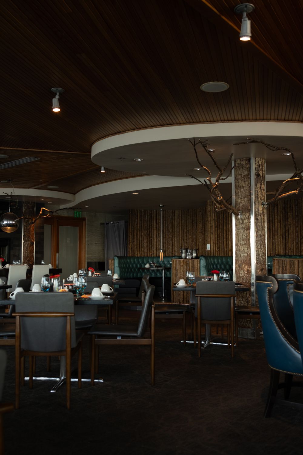 Chicago Restaurant Named Food & Wine’s 2026 Restaurant of the Year Is Changing How Dining Works 2 Elegant restaurant interior featuring wooden decor and ambient lighting.