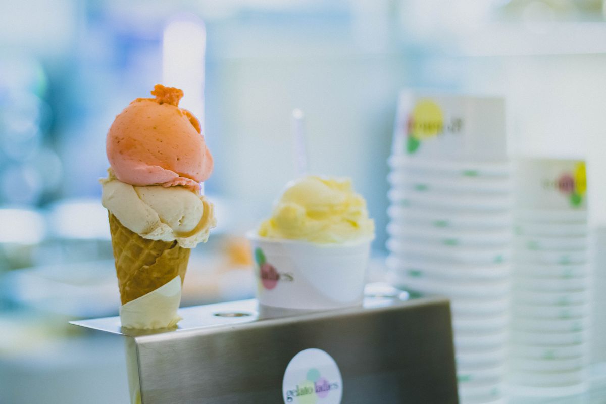 Indulge in creamy vanilla and fruity gelato scoops in a cozy ice cream shop.