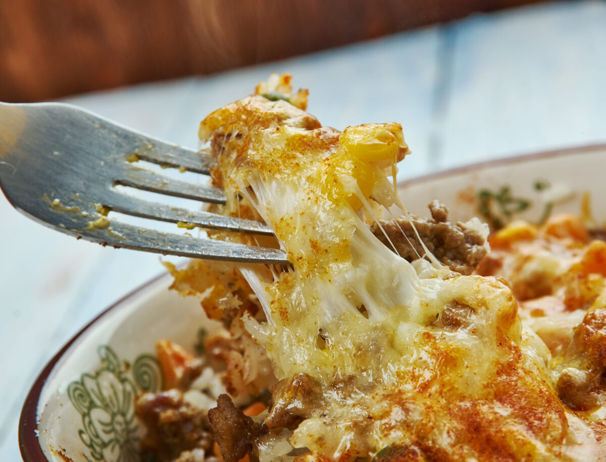 10 Iconic Signature Casseroles From Different States That Americans Still Love 1 Chicken Pot Pie Rice Casserole close up,chicken, mixed vegetables, cheddar, cream of chicken, sour cream and rice