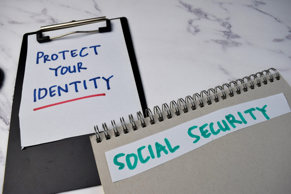 10 Things You Should Think Twice About Carrying in Your Wallet After 50 1 Protect Your Identity and Social Security write on a book isolated on Office Desk.