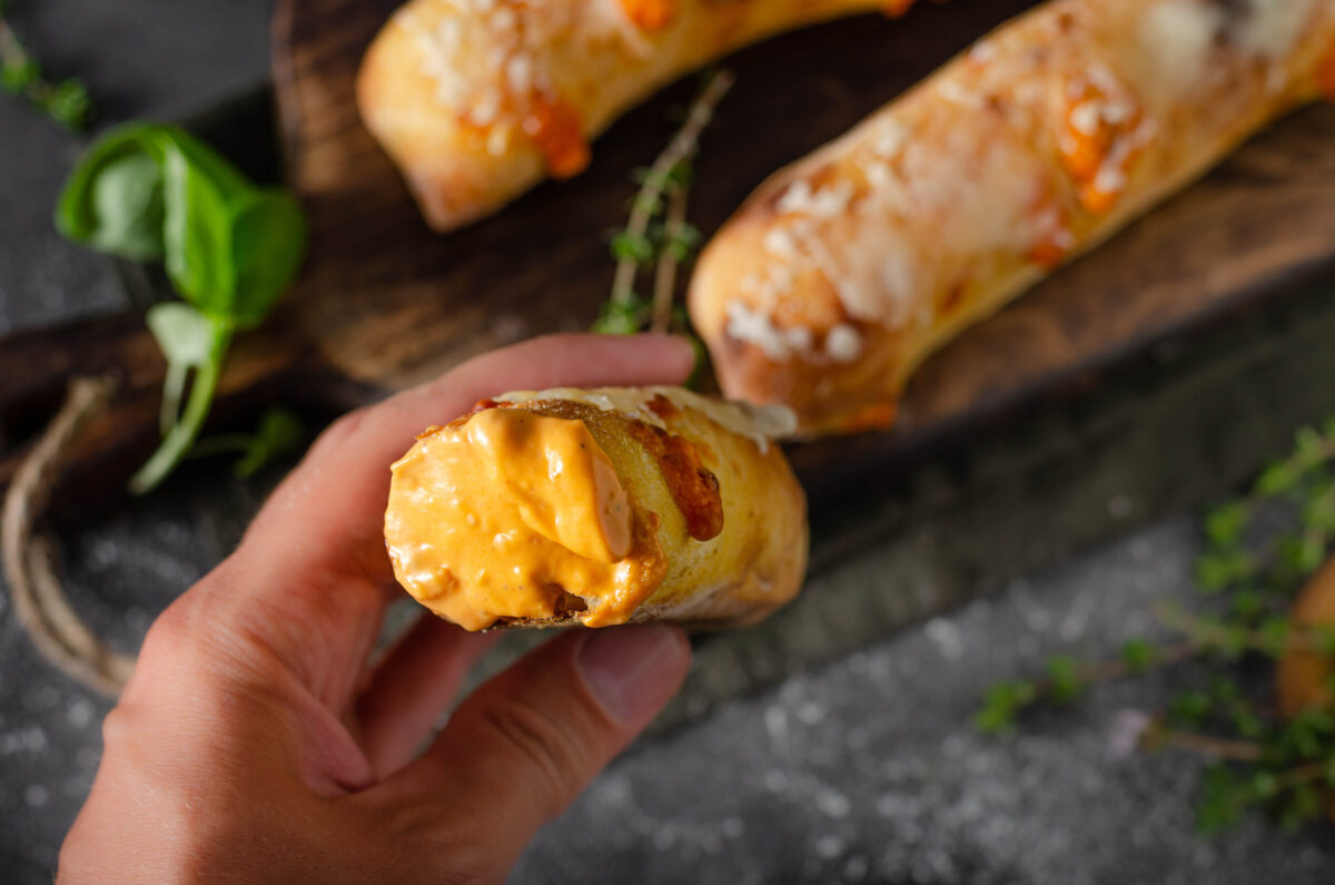 Delicious pastry stuffed with sharp cheese with cheese dip