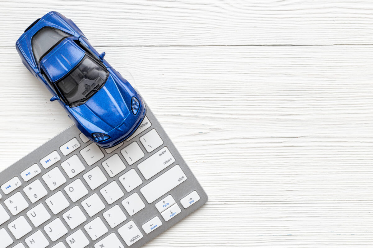 10 Expenses Couples Should Revisit After Retirement to Avoid Wasting Money 1 Car for sale concept. Toy car near computer keyboard