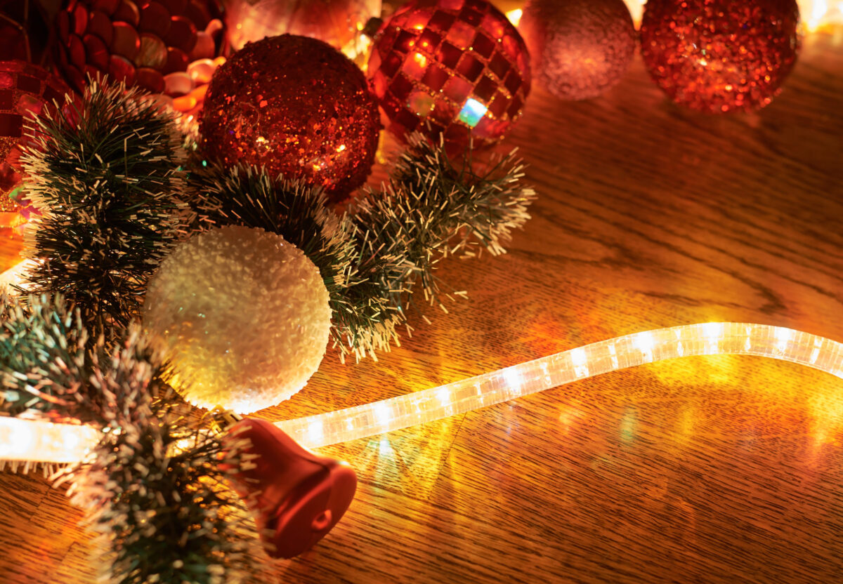 Festive Christmas background as a xmas decorations hightlightened with a garland