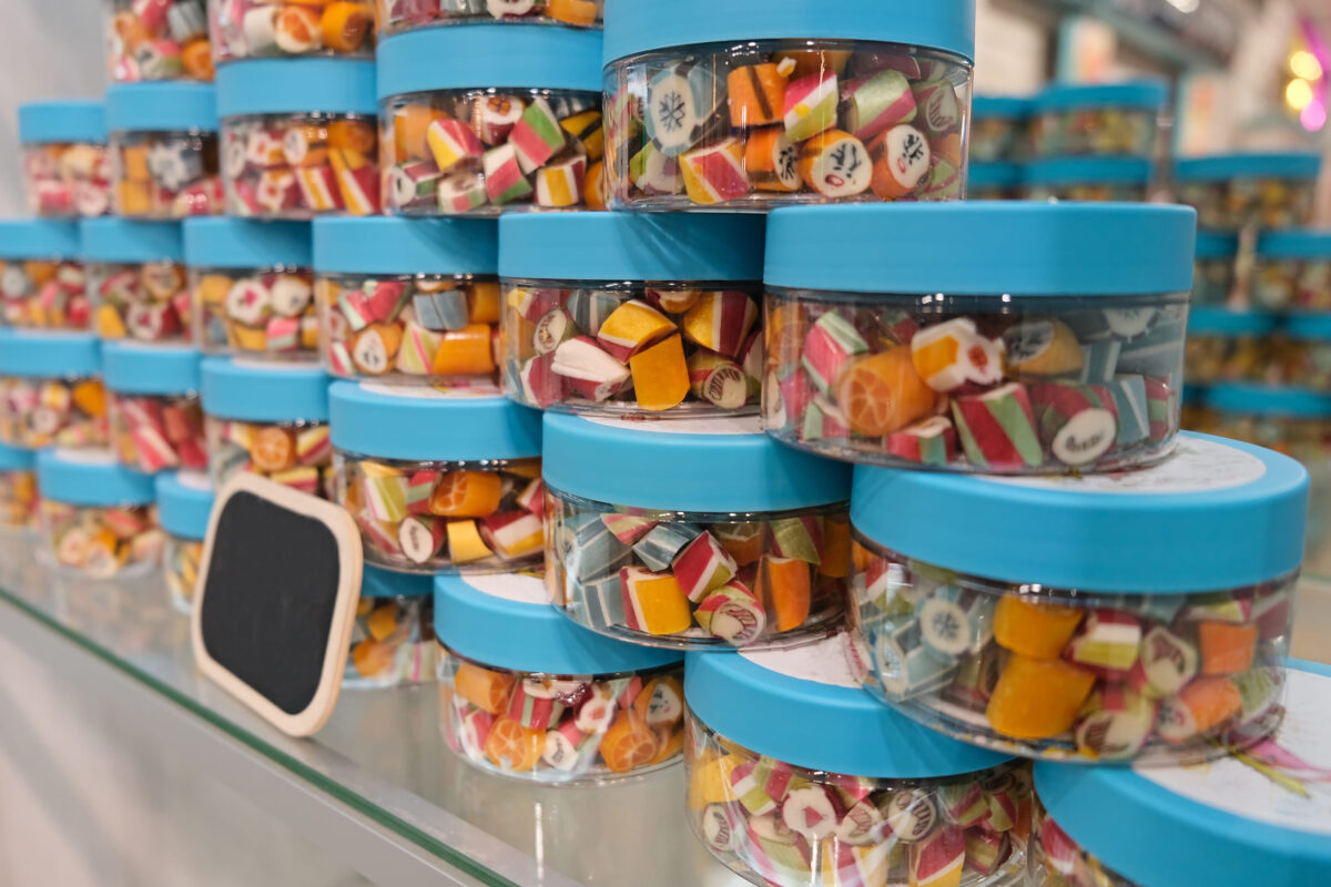 Christmas lollipops in the store during the New Year holidays. tree and snowman symbols of Christmas.