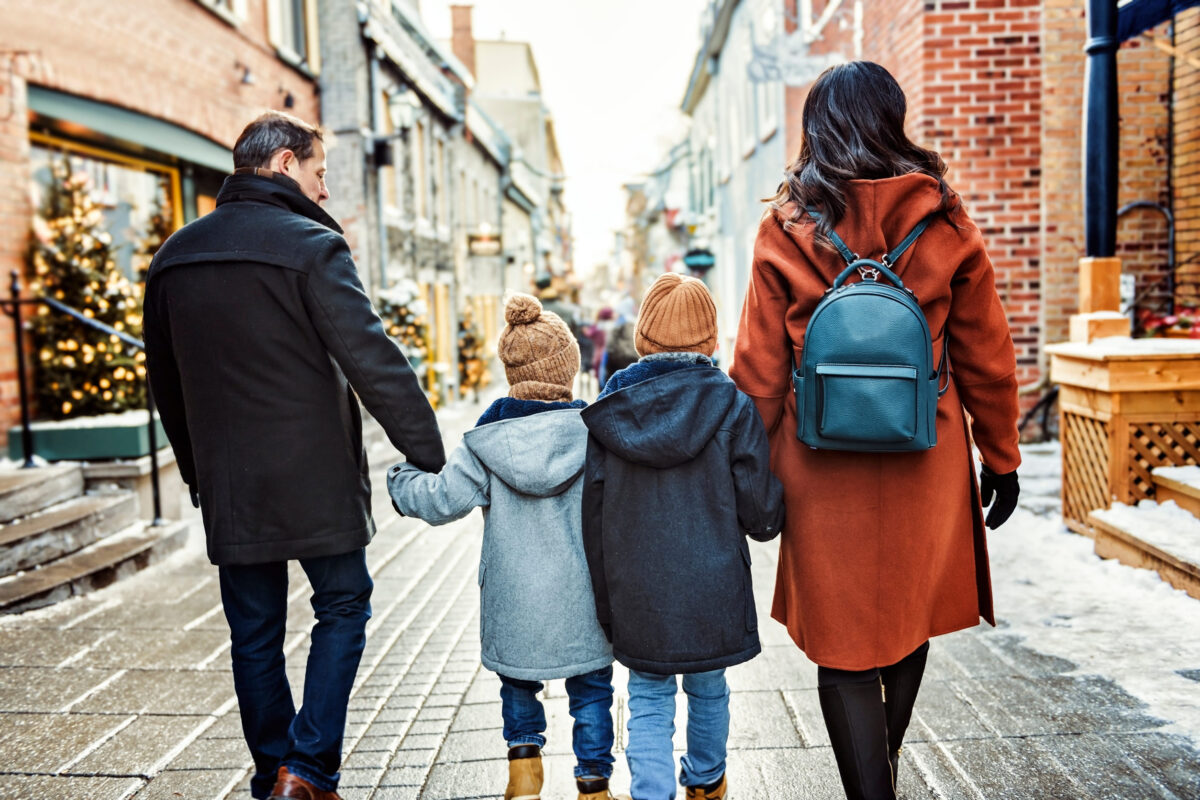 8 Sunday Dinner Traditions That Have Quietly Faded 1 family with two little son having fun together outdoor on frosty day