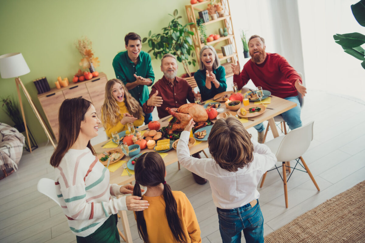 Photo of charming happy big family celebrating thanksgiving day listening children telling poem greetings indoors room home