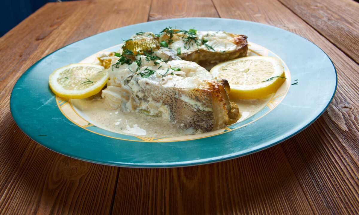 Halibut in Lemon Cream. served with lemon, fresh vegetables