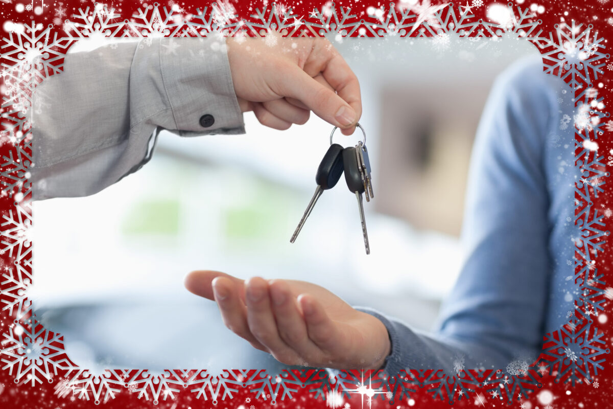 Composite image of man giving keys to someone against snow