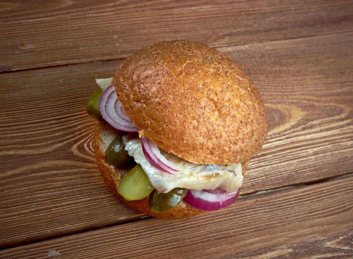 Fischbrotchen -  sandwich made with fish and onions.eaten in Northern Germany. preparation  bismarck herring or soused herring
