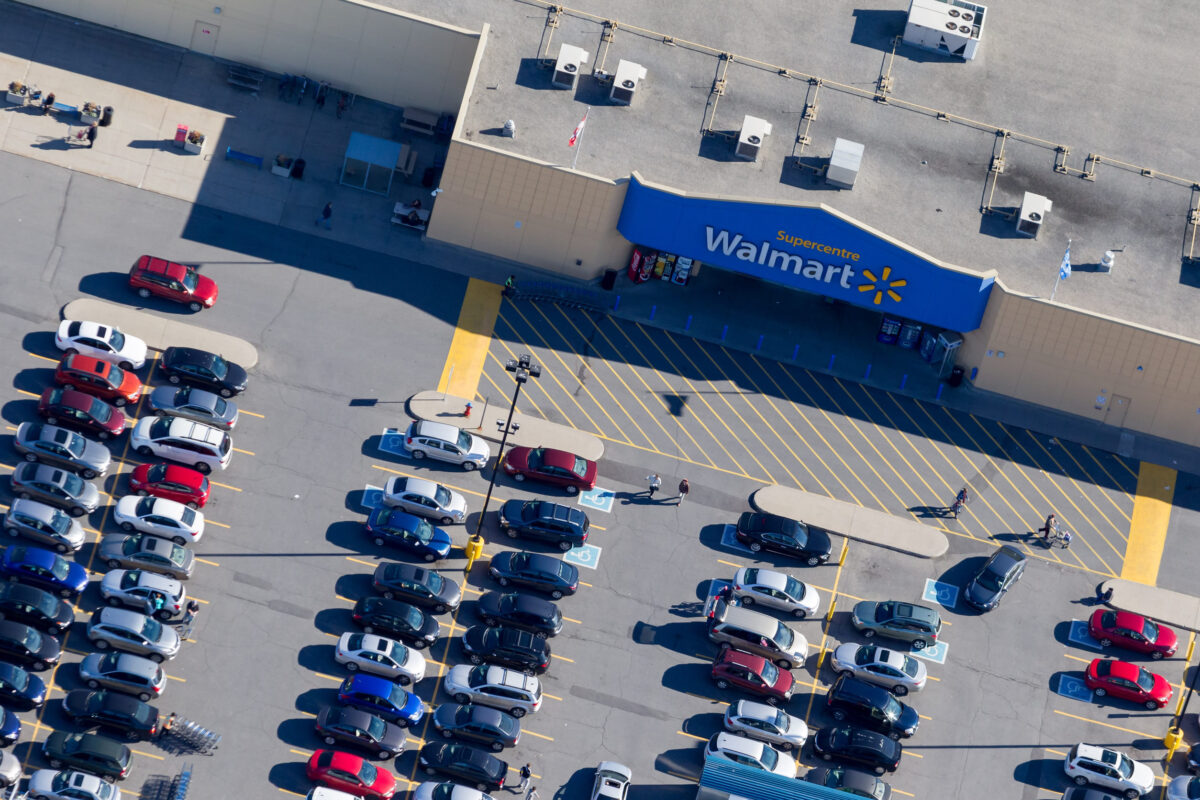 Montreal, October 13, 2016. Aerial view over the Walmart Supercentre retail store on a busy shopping day with customers reaching for their cars after making their purchase. Canada
