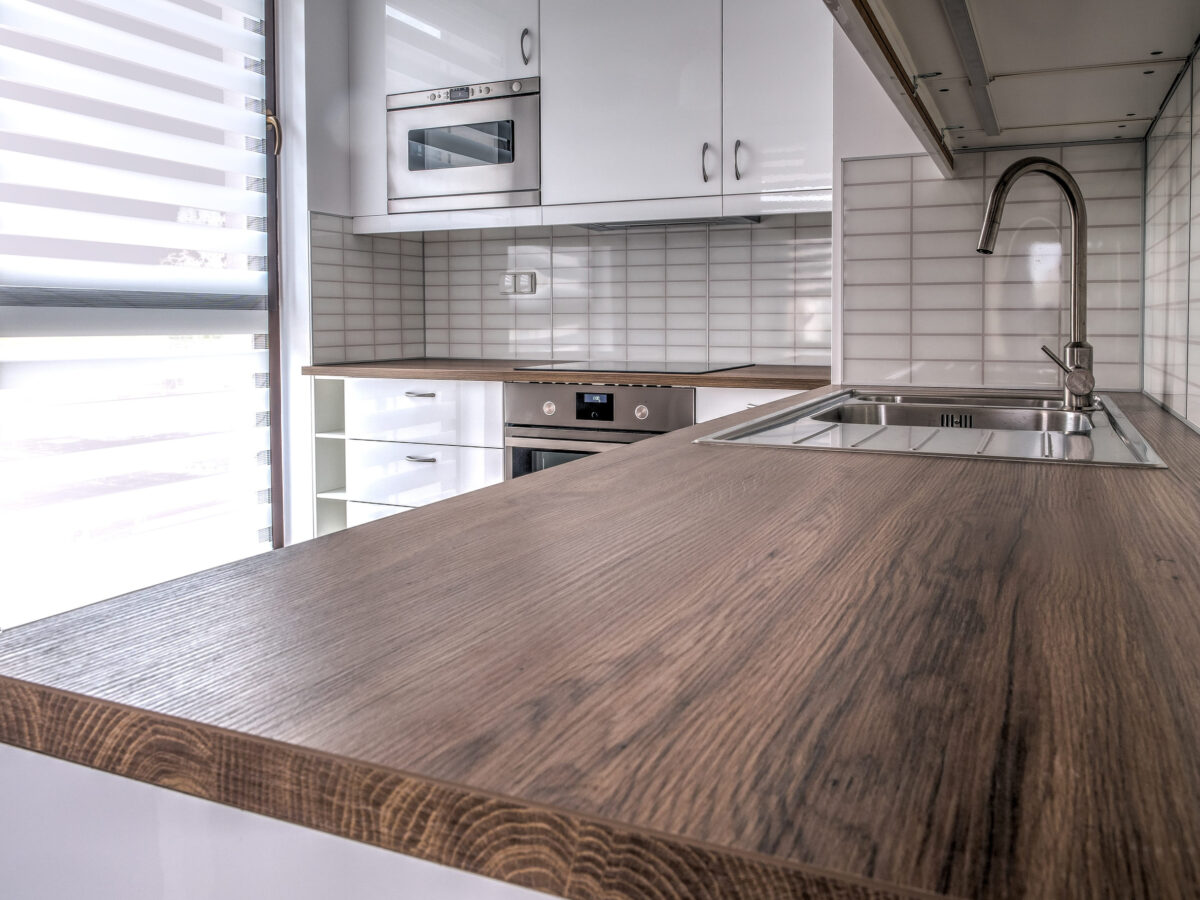 10 Things Every '90s Kitchen Had 3 New furnished apartment, small, white kitchen with window.