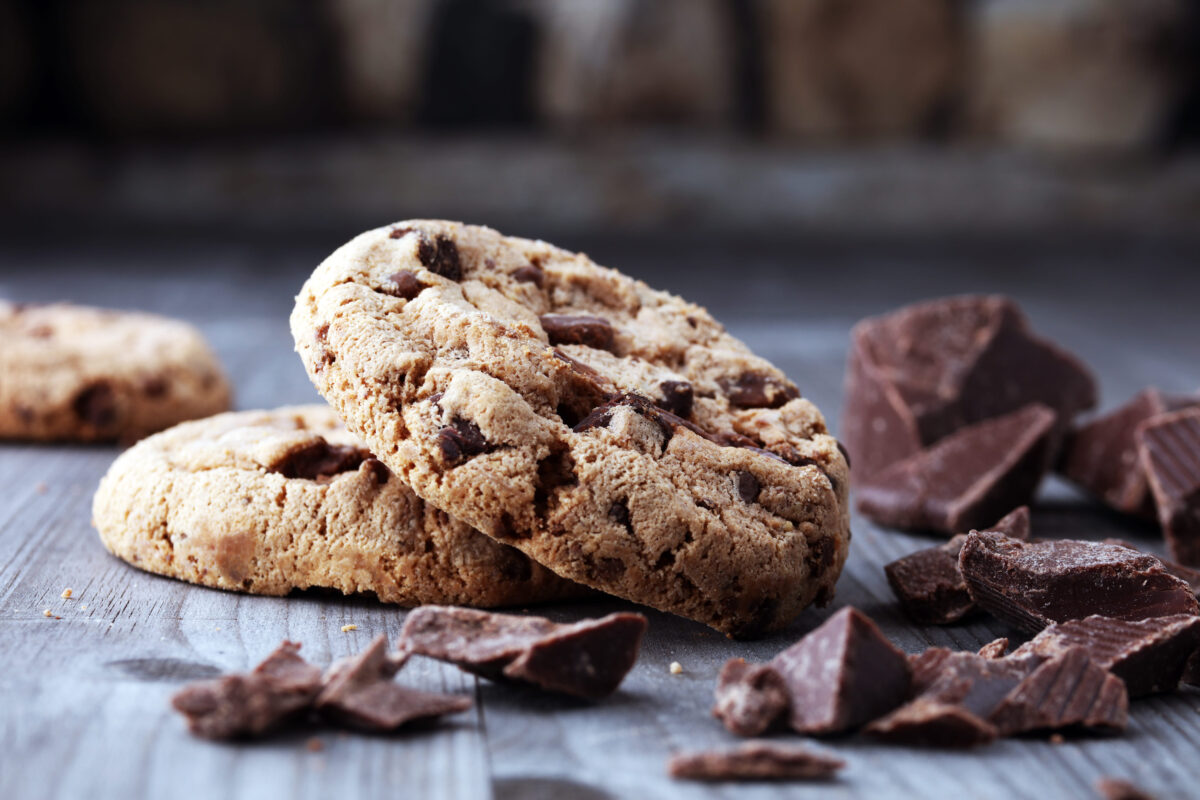 Chocolate cookies on wooden table. Chocolate chip cookies shot.