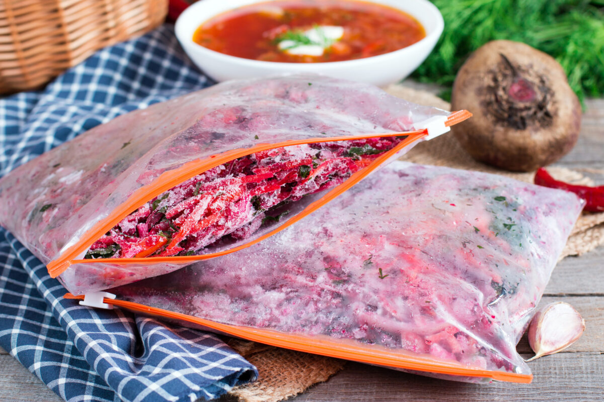 Ingredients for borsch Procurement. Freezing. Soup cooking on a brown wooden background.