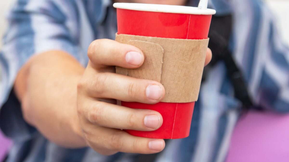Starbucks Red Cup Day 2026: What Has Been Confirmed So Far 1 Man Holding Starbucks Red Cup