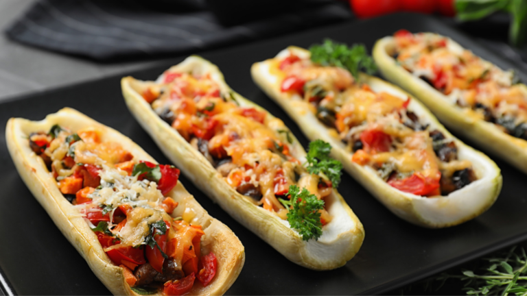 Delicious and nutritious stuffed zucchini boats filled with a colorful medley of vegetables and topped with melted cheese, perfect for a healthy meal or appetizer. Image Credit: liudmilachernetska/ 123RF