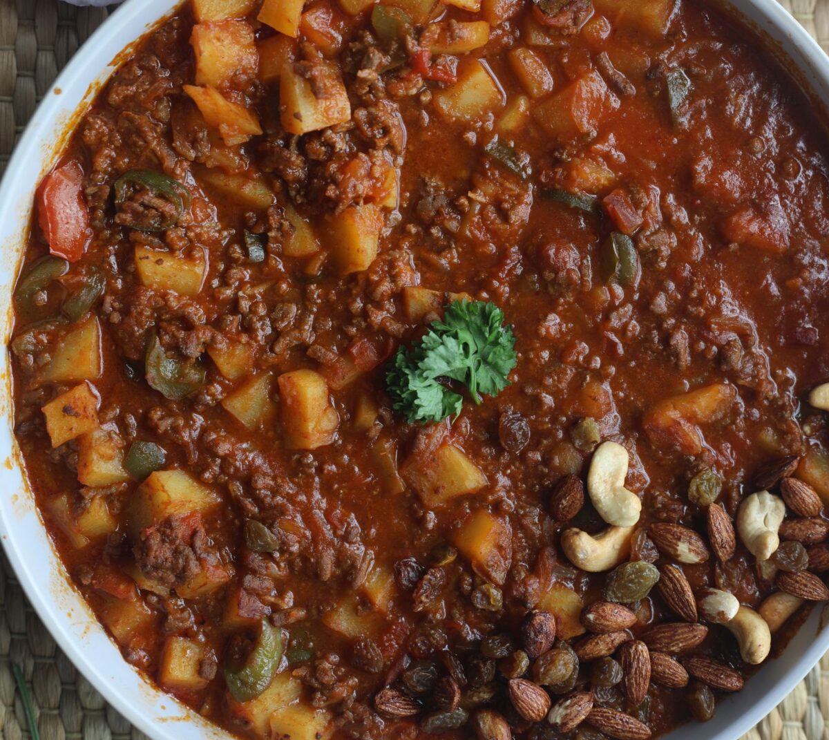 A delicious Malaysian stew with potatoes and nuts, captured in a top view shot.