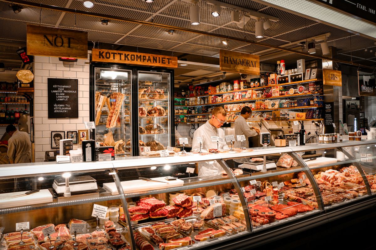 What Really Happens to Unsold Meat and Seafood at Costco? 1 A vibrant butcher shop counter in Stockholm, Sweden, featuring various fresh meats and products.