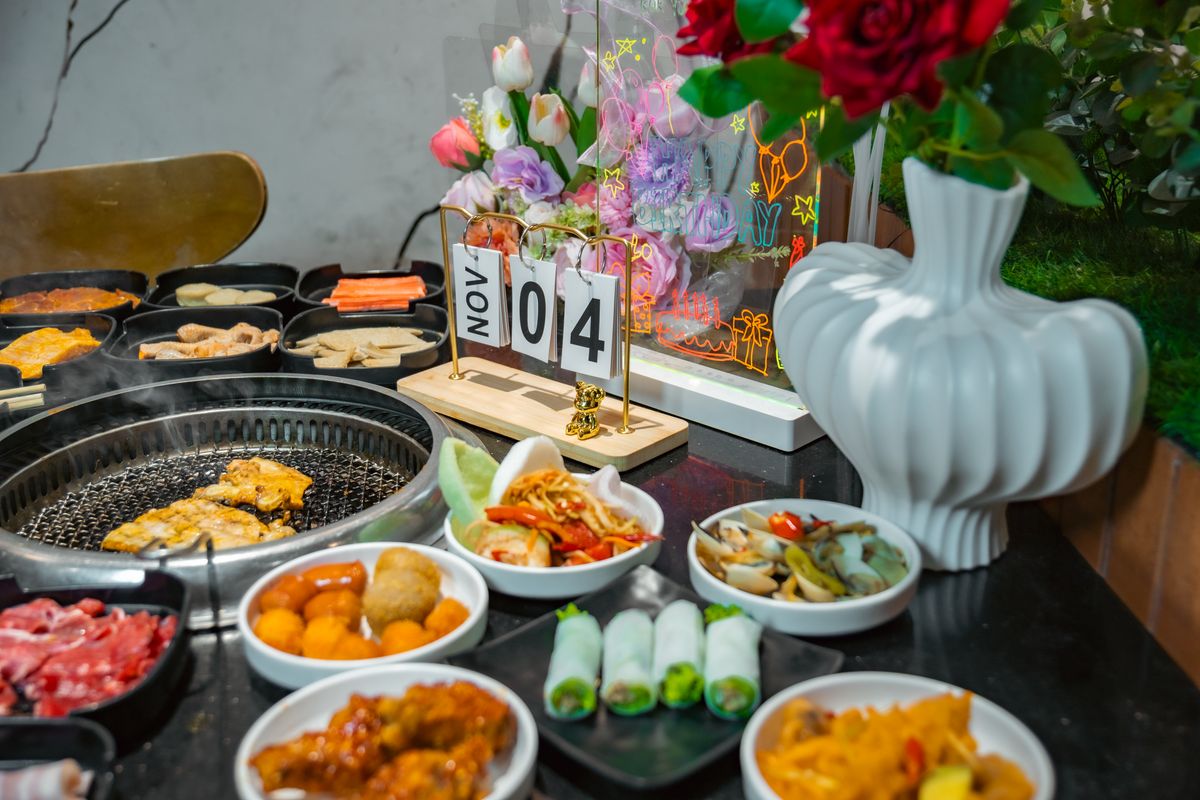 Philadelphia’s Food Calendar Is Packed and the Best Part Isn’t Just Dinner 1 A vibrant table setting featuring diverse Asian BBQ dishes, perfect for celebrations.