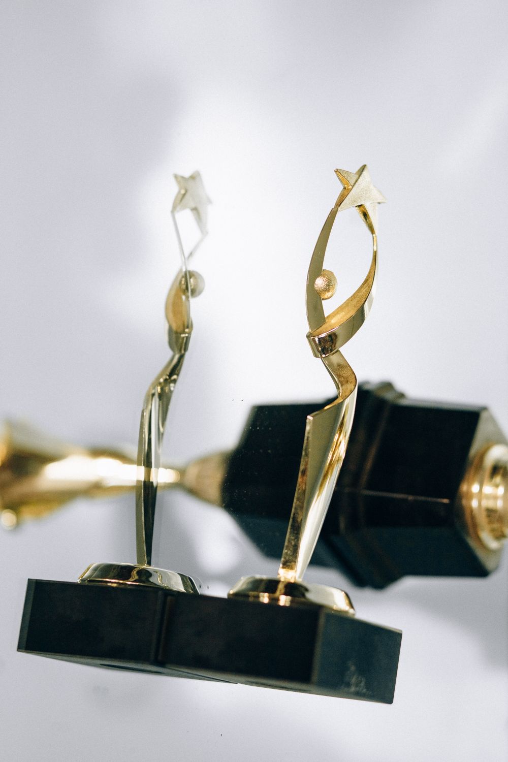 An elegant golden trophy with a star design, symbolizing excellence and achievement, perfect for award ceremonies.