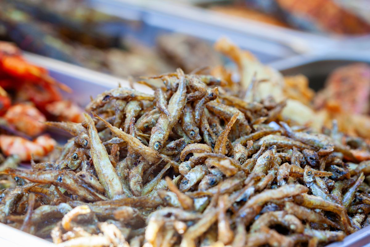 Close-up of crispy seasoned fried anchovies, perfect for food photography enthusiasts.