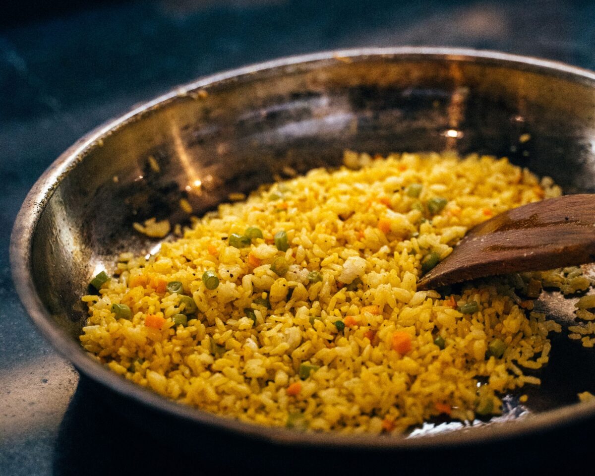 Close-up of delicious fried rice with vegetables in a pan, perfect for culinary usage.