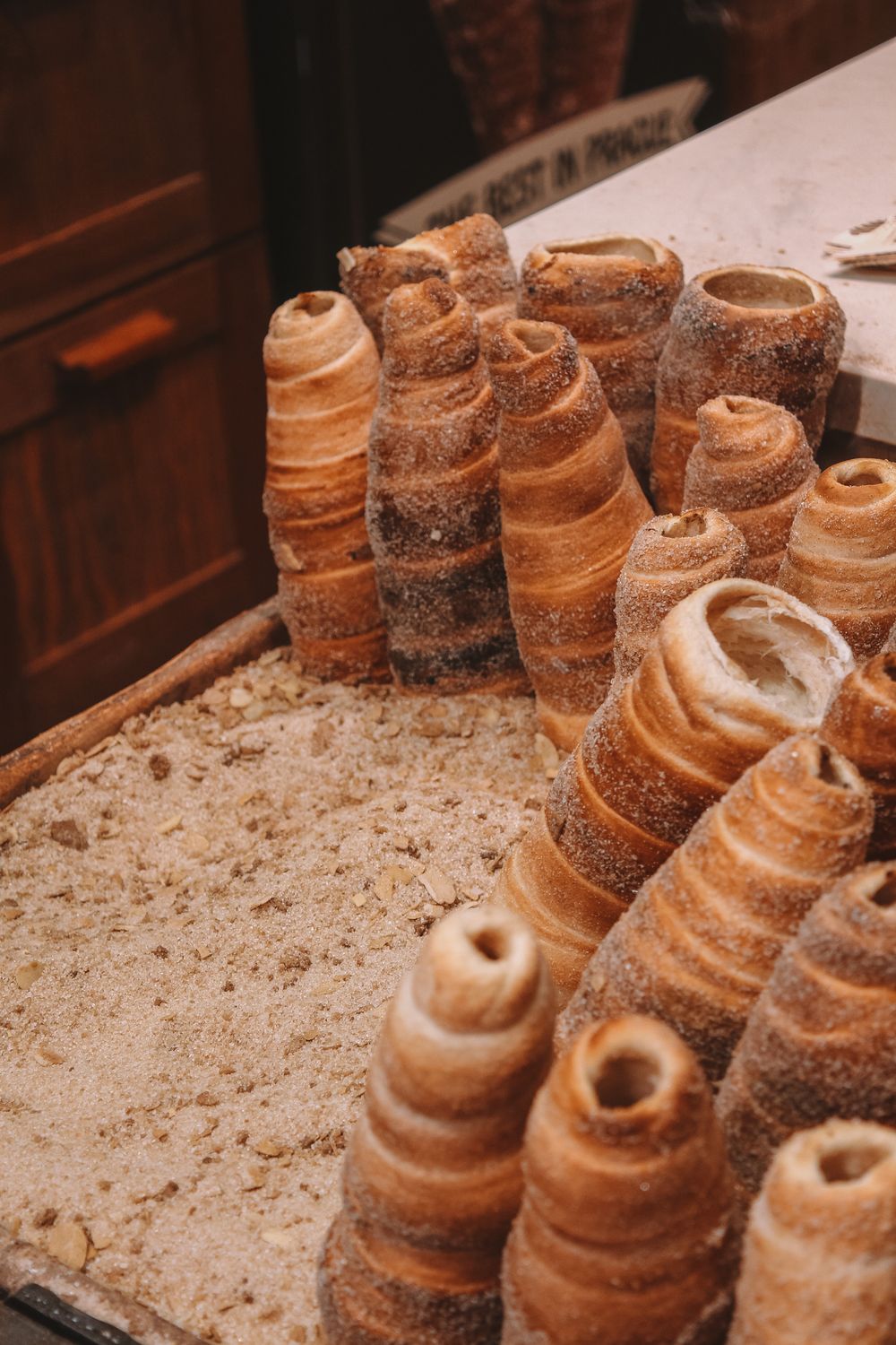 Close-up of delicious Trdelník pastries in Prague, showcasing traditional Czech street food.