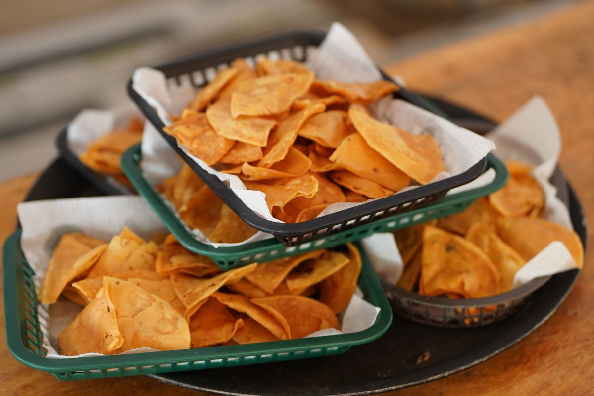 9 Grocery Store Tortilla Chips, Ranked From Worst to Best 1 Crispy tortilla chips stacked in baskets, offering a taste of Mexican cuisine.