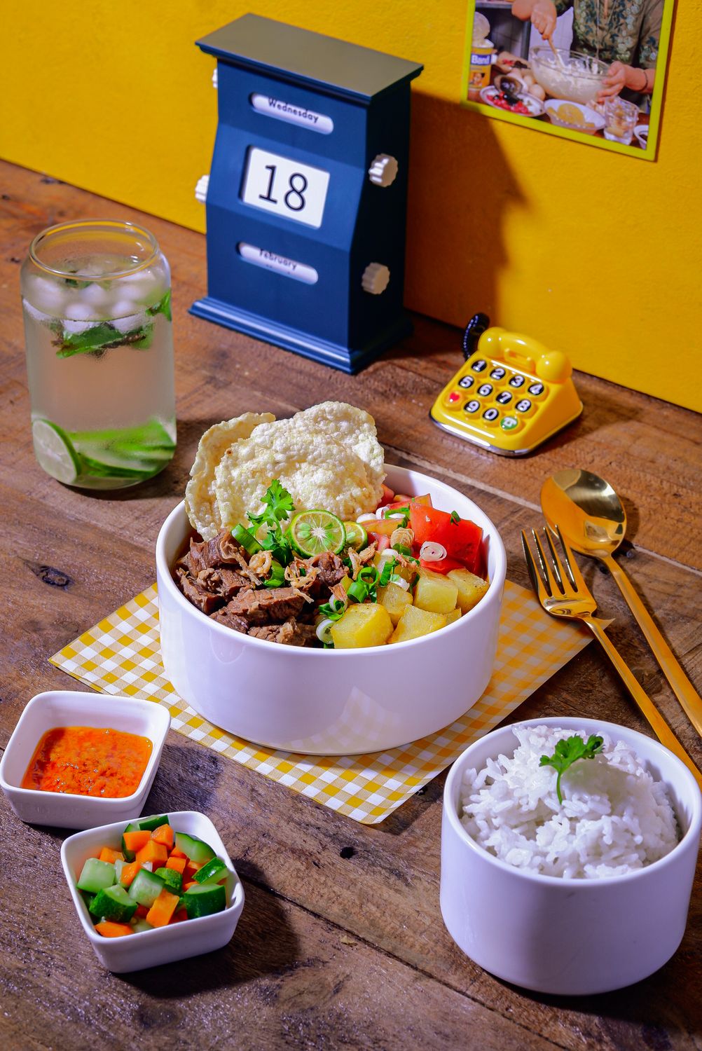 Philadelphia’s Food Calendar Is Packed and the Best Part Isn’t Just Dinner 2 Delicious Asian meal with rice, beef, and vegetables served on a rustic table with refreshing drink.