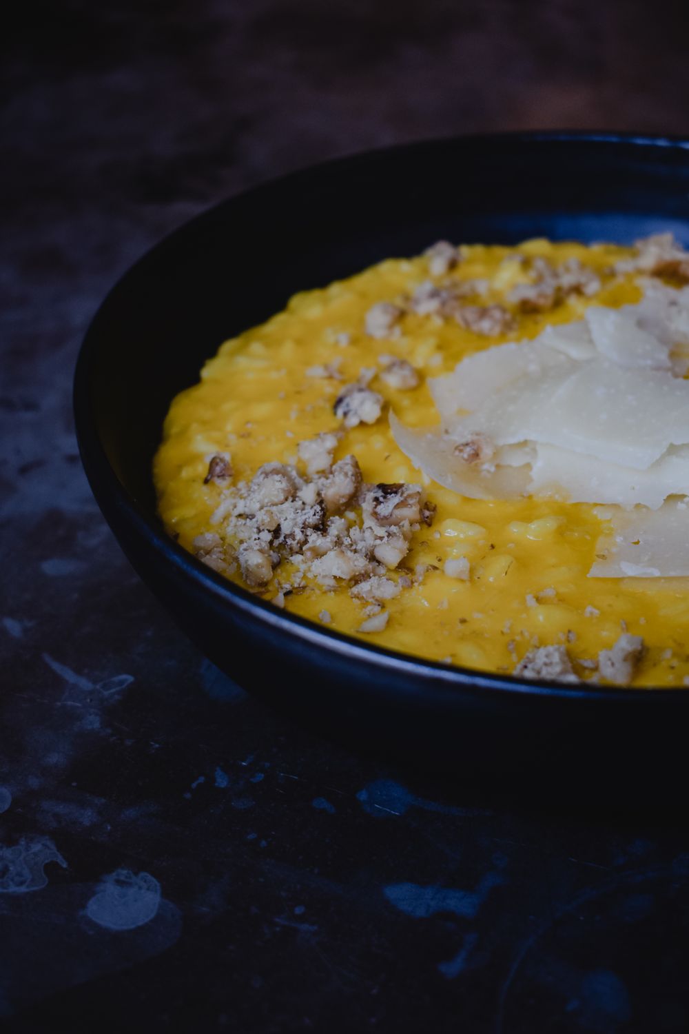 Delicious Milanese risotto with truffle, plated for fine dining experience.