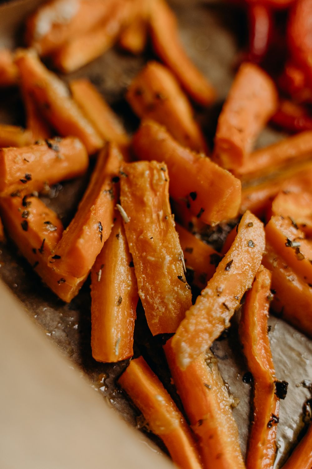 Delicious roasted carrot sticks with herbs, perfect for a healthy vegan recipe.