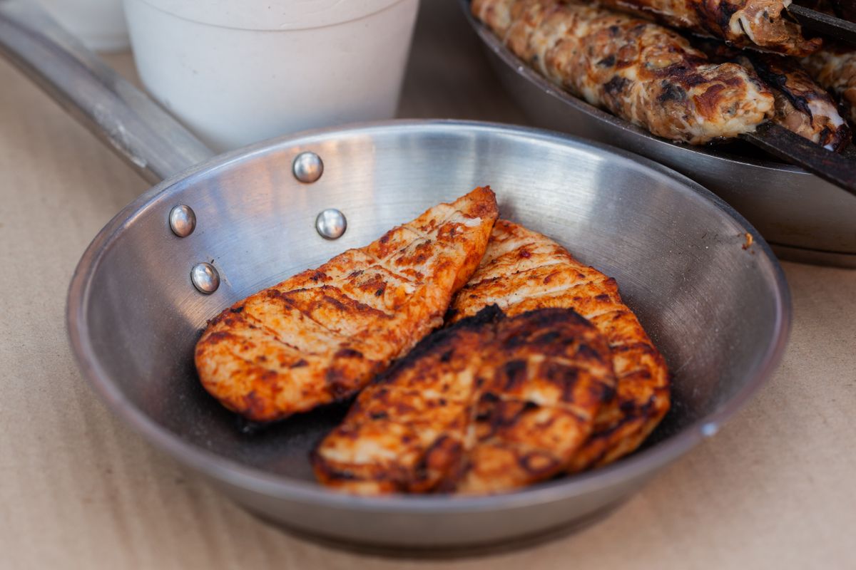 8 Popular Restaurant Foods Professional Chefs Think Twice About Ordering 1 Delicious seasoned chicken breasts grilled and served in a stainless steel pan.