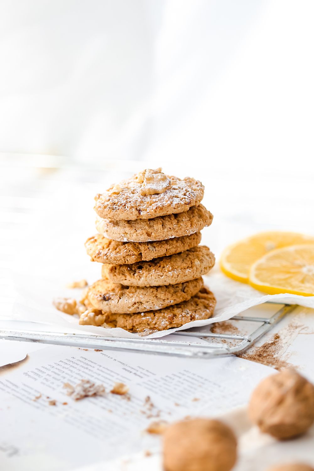 Delicious stack of oatmeal cookies with lemon slices, perfect for food photography and culinary inspiration.
