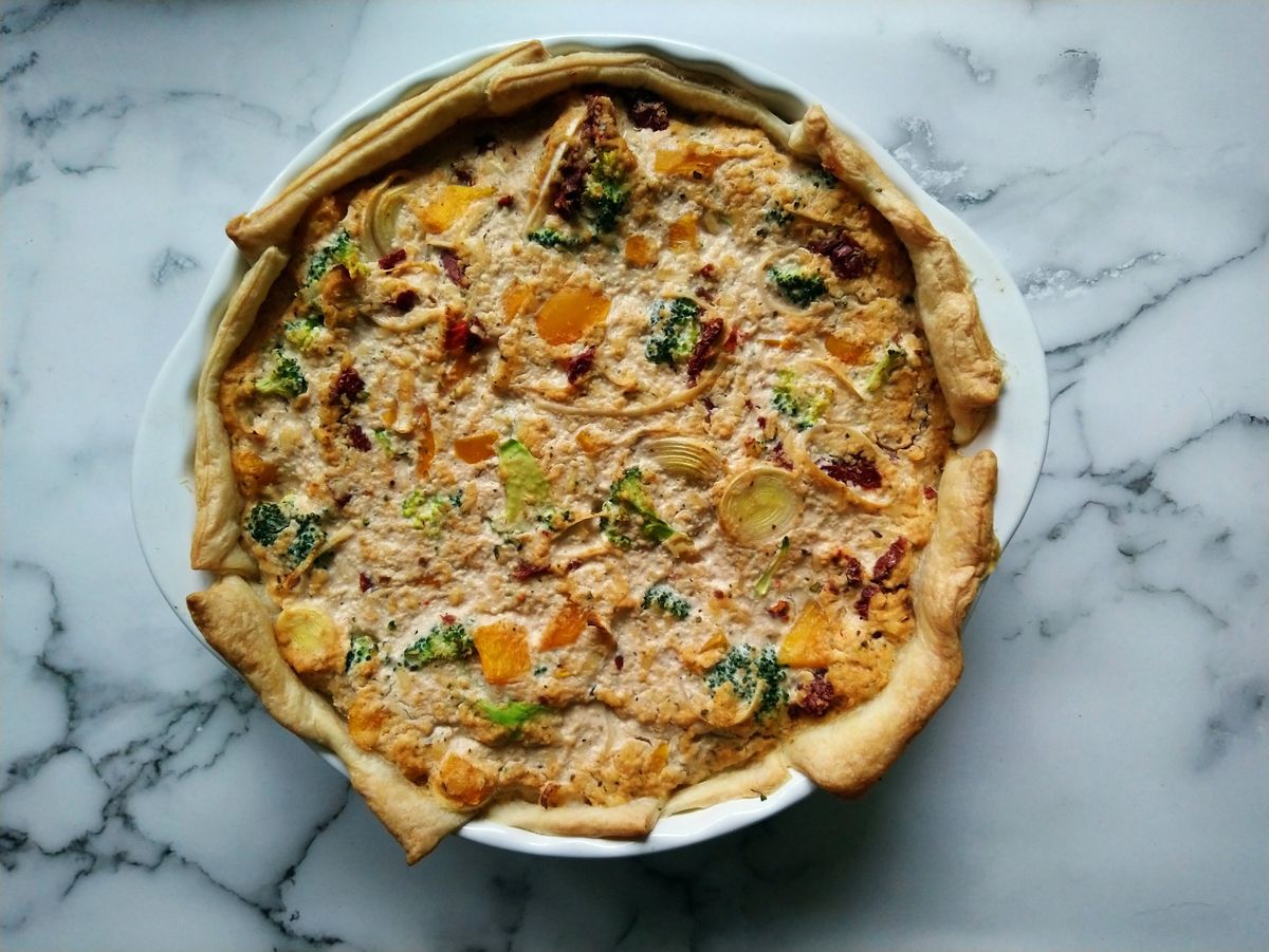 This French Onion Tart Delivers Golden Pastry and Melty Gruyère Without Making Dough From Scratch 2 Delicious vegan quiche featuring broccoli, onions, and herbs in a flaky crust, perfect for brunch.