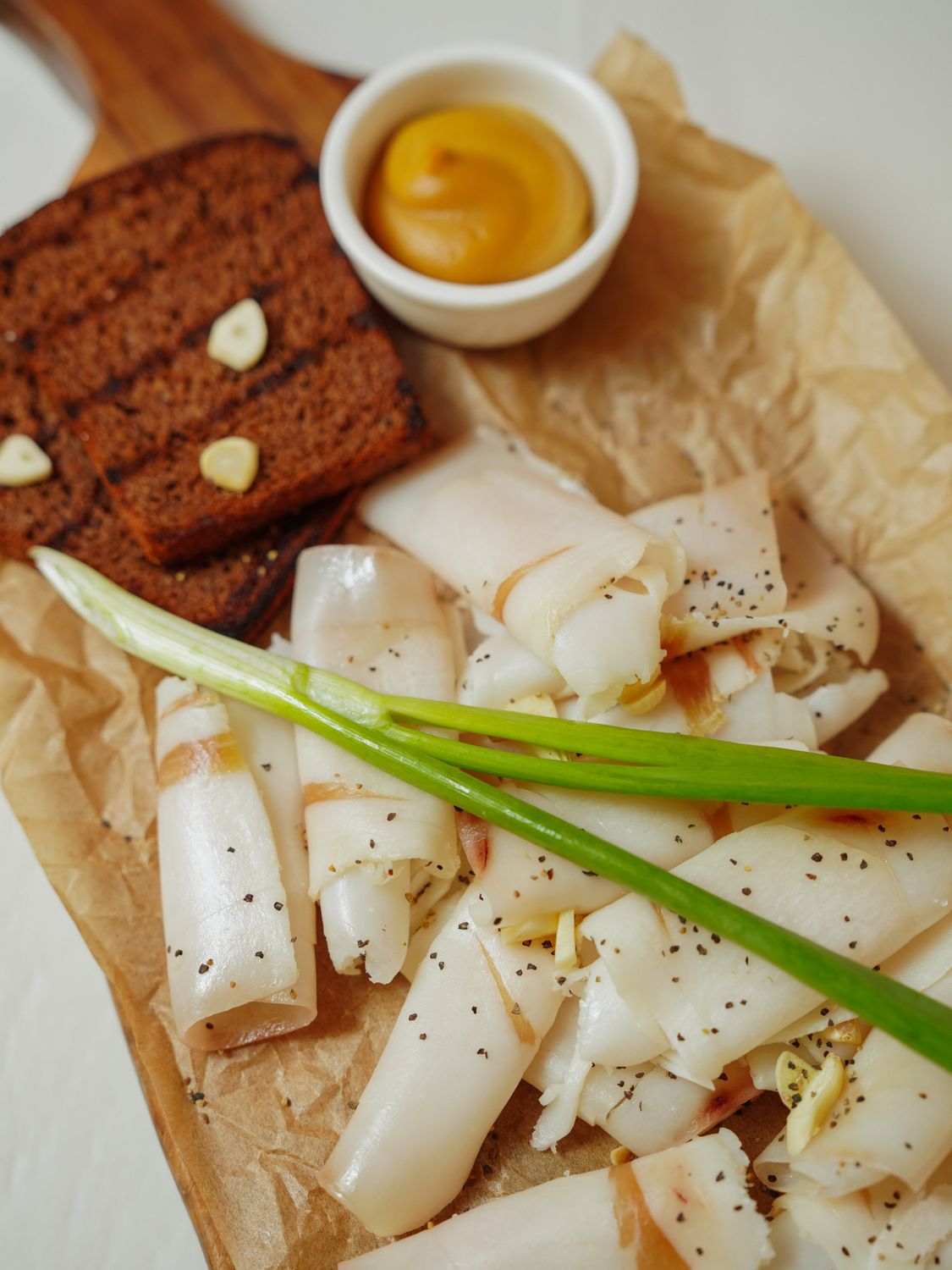 Beef Tallow Is Sizzling Again And Restaurants Are Betting Diners Will Taste the Difference 1 Delight in savory lard slices with rye bread and mustard, a gourmet culinary treat.