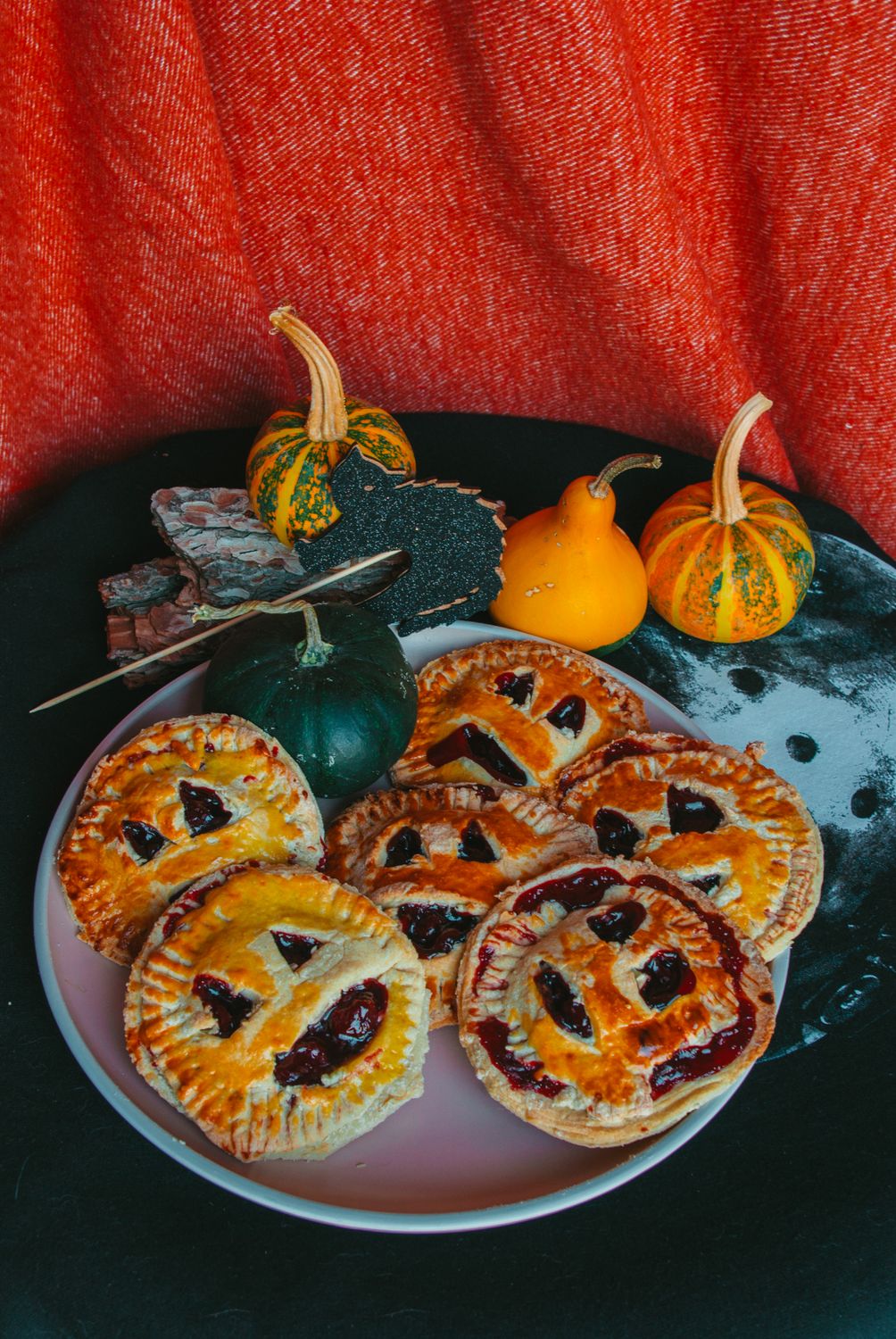 Festive pumpkin pies with spooky decoration for a Halloween celebration.