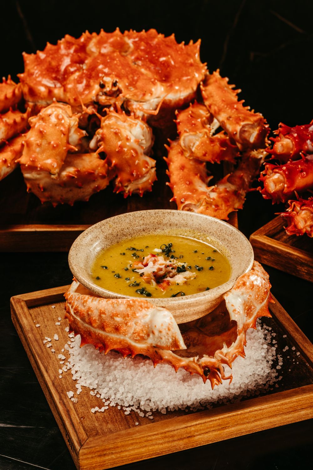 Luxurious presentation of crab dish served with rich sauce, perfect for gourmet dining.