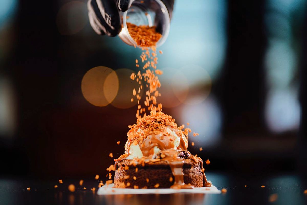 9 National Food Days Left in 2026 That Come With Real Freebies 1 Mouth-watering dessert topped with crunchy bits, captured with vibrant focus.