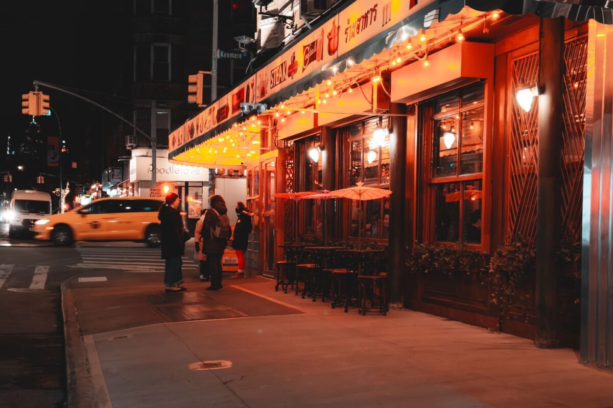 vibrant-nyc-street-scene-with-lit-restaurant-at-night