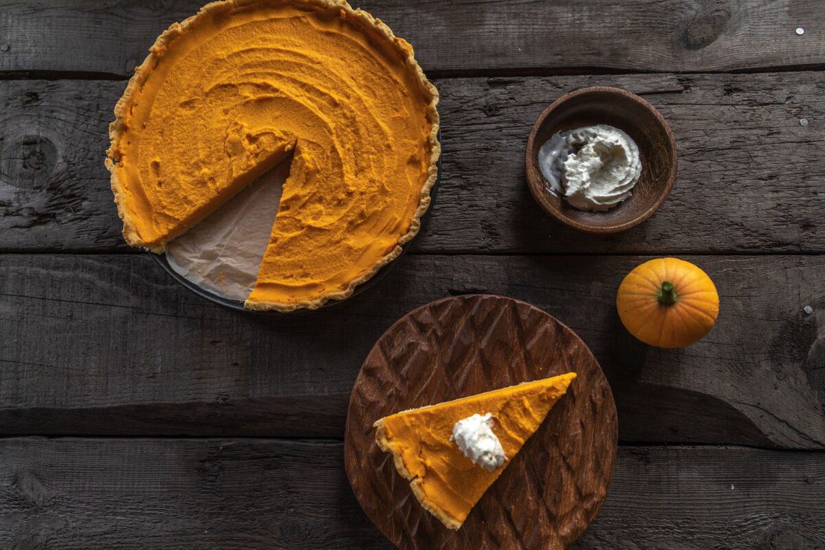 a-top-shot-of-a-pumpkin-pie-on-a-wooden-surface